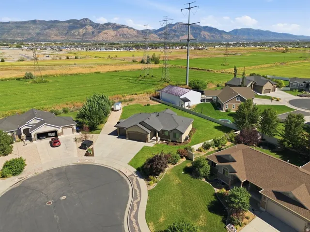 Cul-de-sac location with a concrete driveway and attached garage
