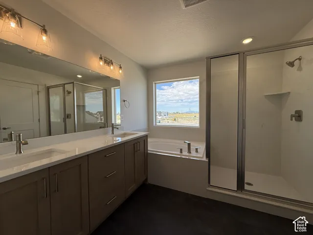 Dual vanity with undermount sinks and light-toned countertops
