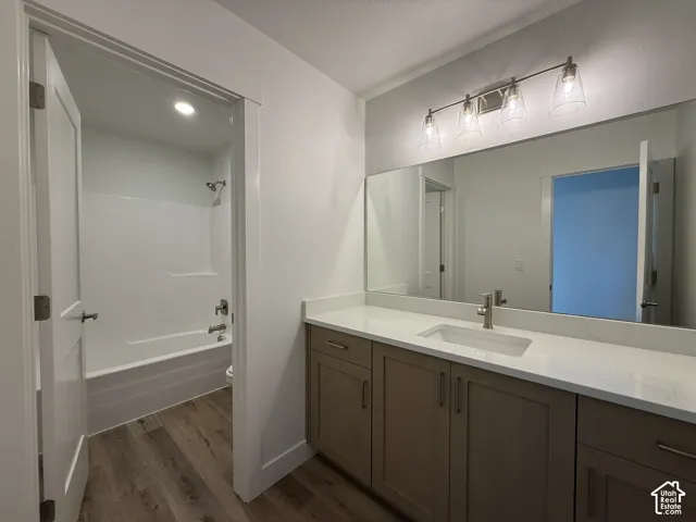 Double vanity with white countertop, undermount sink, and brushed nickel faucet
