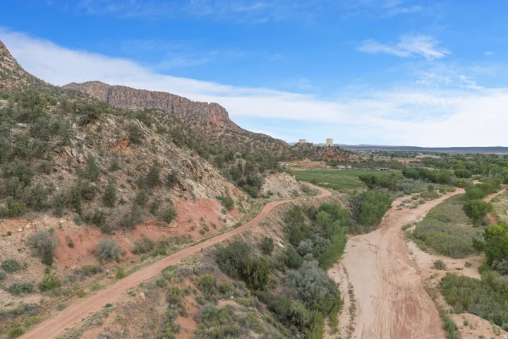Expansive mountainous terrain with a natural unpaved path