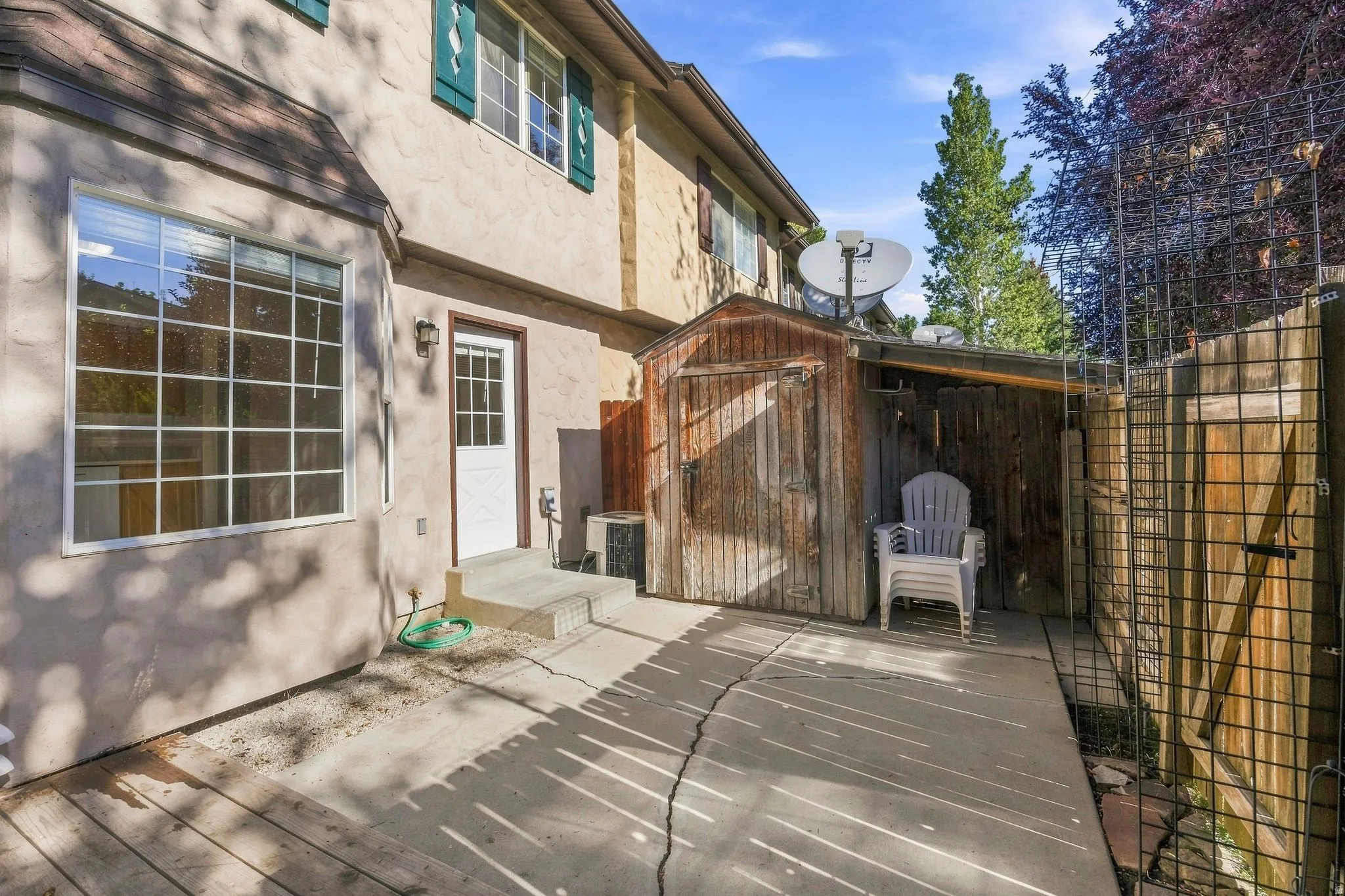 Fenced patio and shed