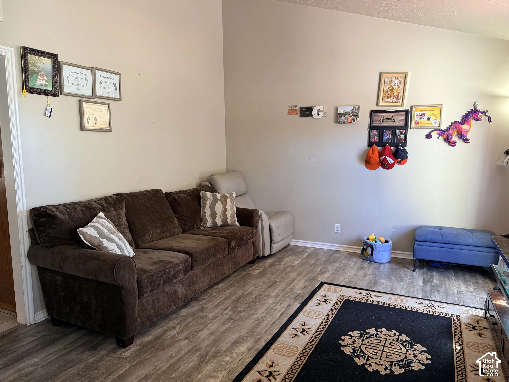 Wood-finish flooring with light-toned walls and white trim