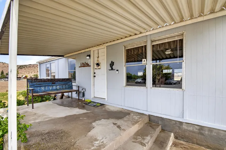 Covered porch with concrete steps