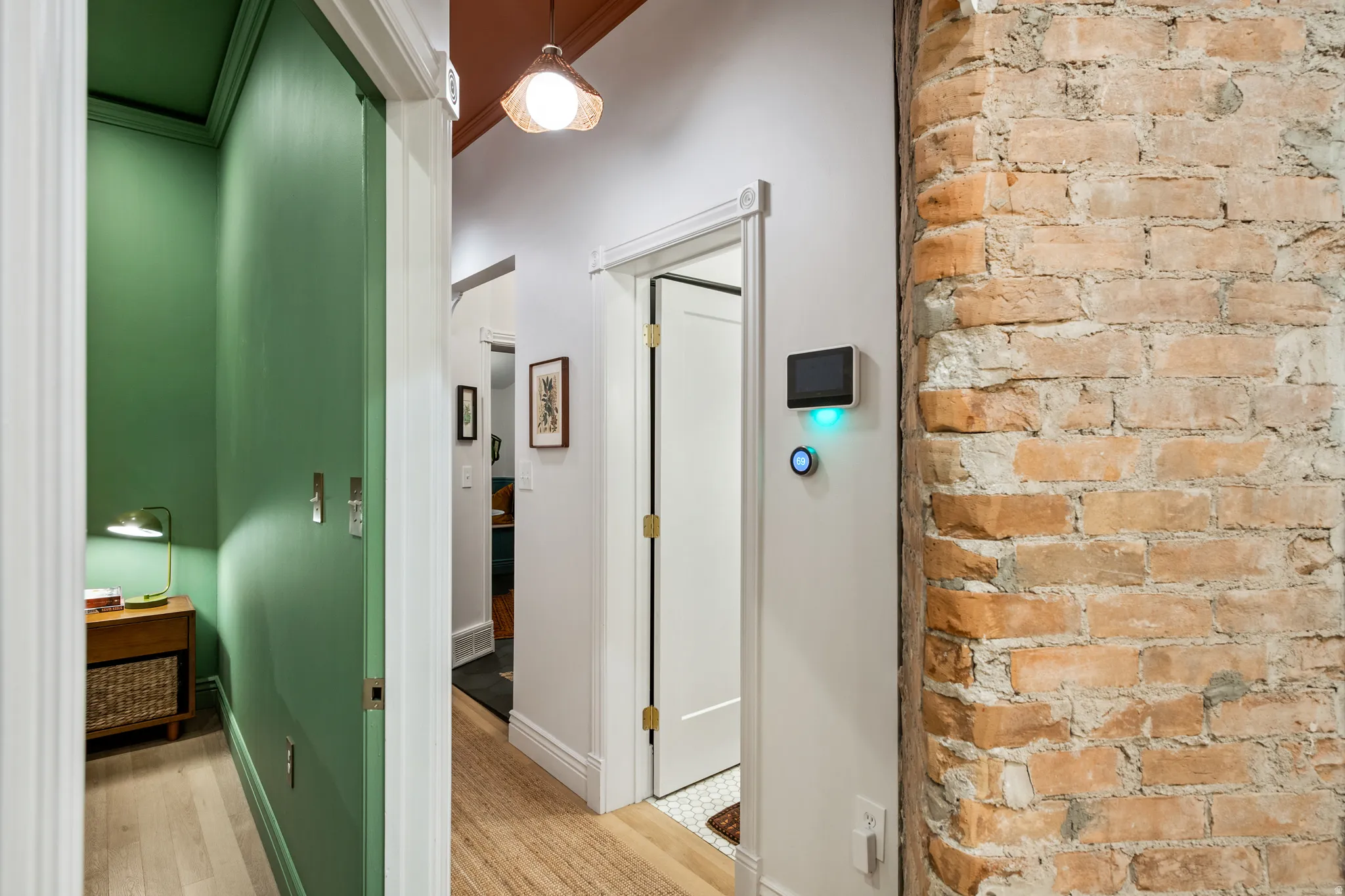 Exposed brick wall detail and wood-finish flooring