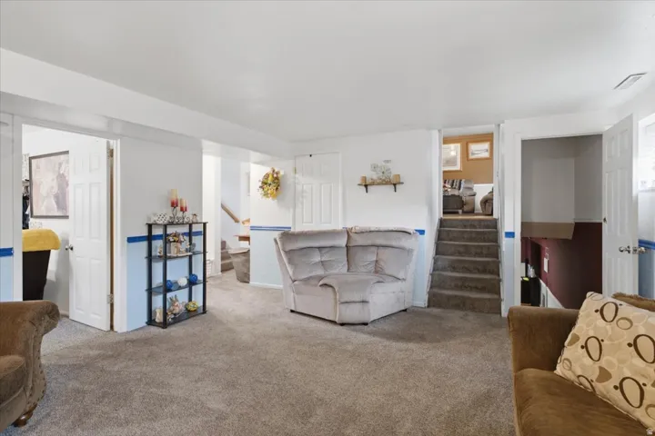 Carpeted flooring, white interior doors.
