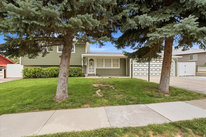 Split-level exterior with green siding and white trim