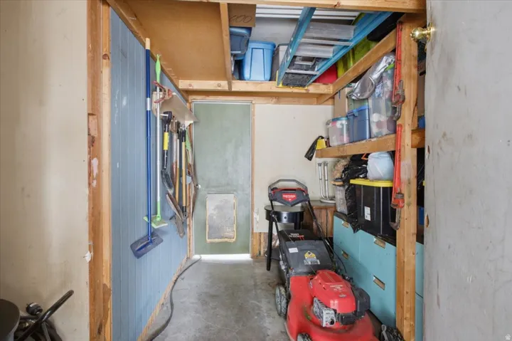 Storage room located inside garage.