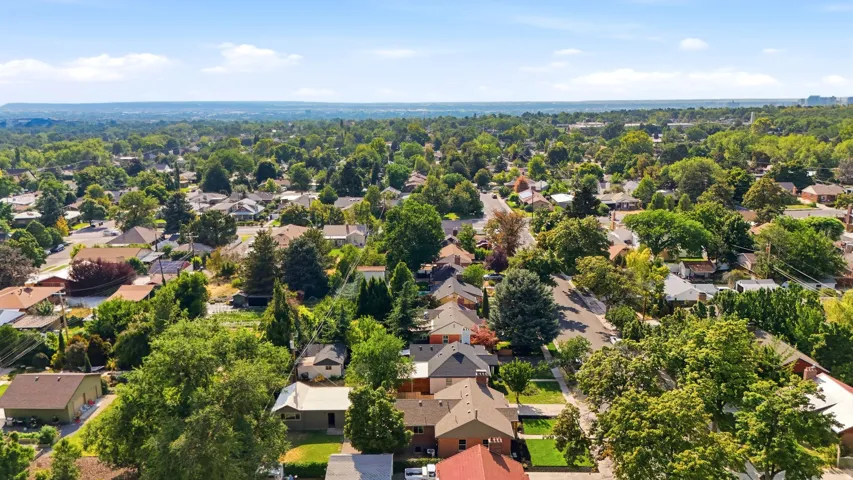 Residential neighborhood with mature trees and paved streets