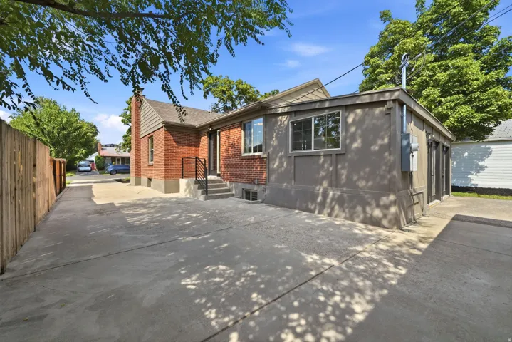 Brick exterior with a gabled roof and stucco addition