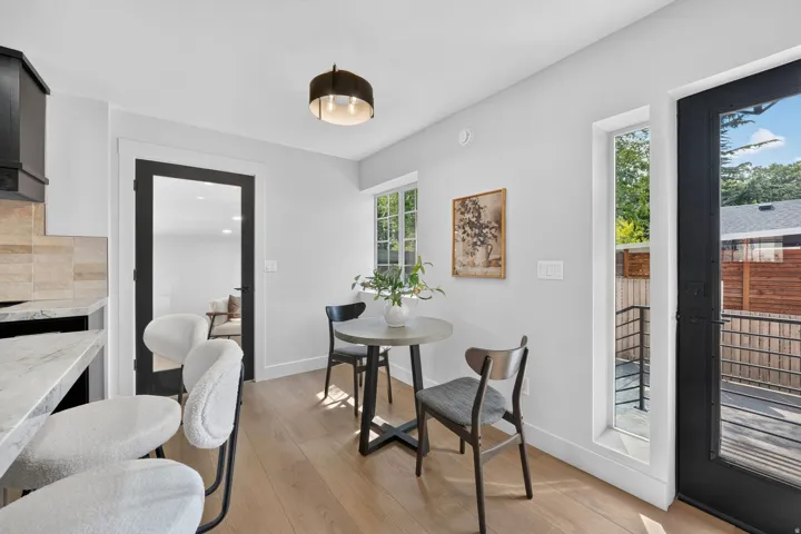 Wood-finish flooring with white walls and trim