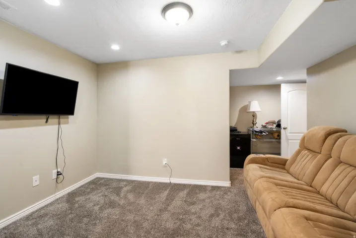 Recessed lighting, ceiling-mounted fixture, and carpeted flooring