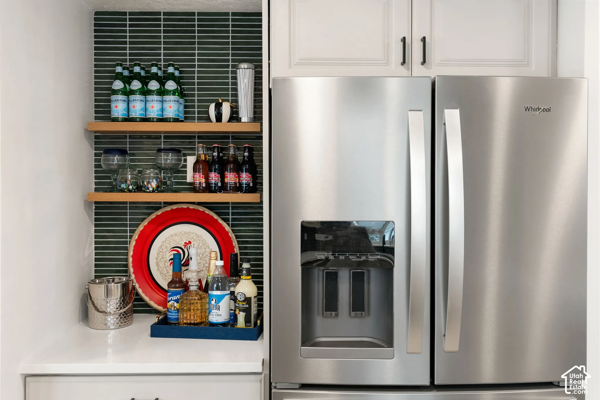 Stainless steel French door refrigerator with an external ice and water dispenser