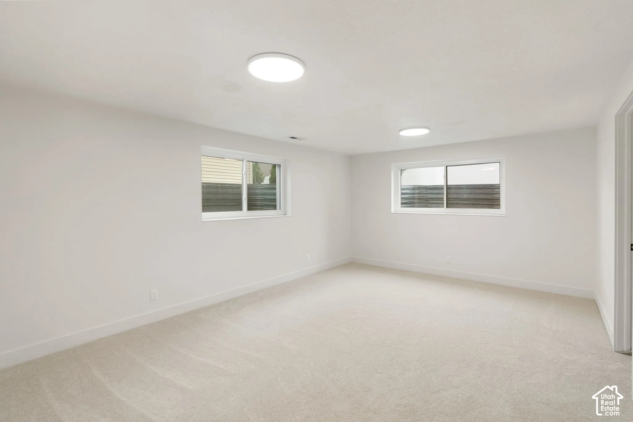 Neutral carpeting and light-toned walls