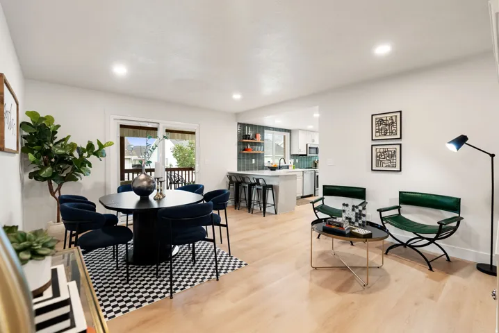 Open-concept living space with light wood-finish flooring