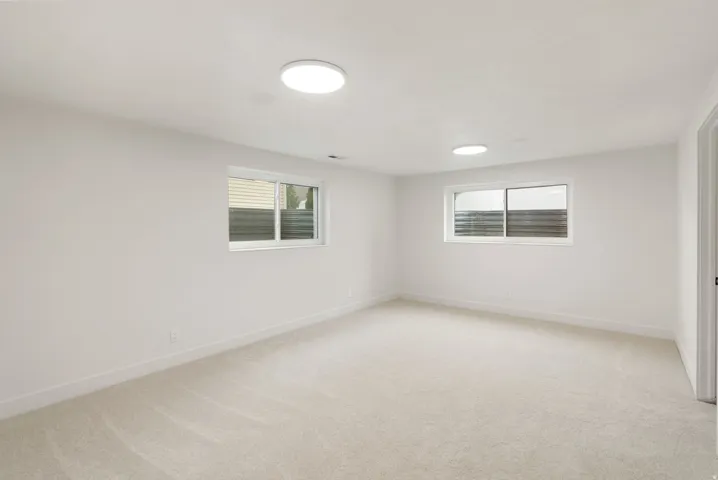 Neutral carpeting and light-toned walls