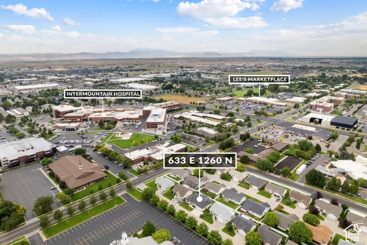 Aerial perspective highlighting a residential neighborhood with a distant mountain backdrop