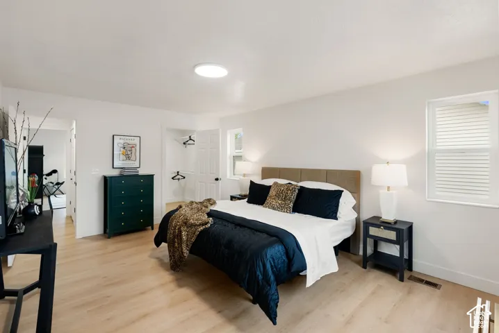 Light wood-finish flooring with white walls