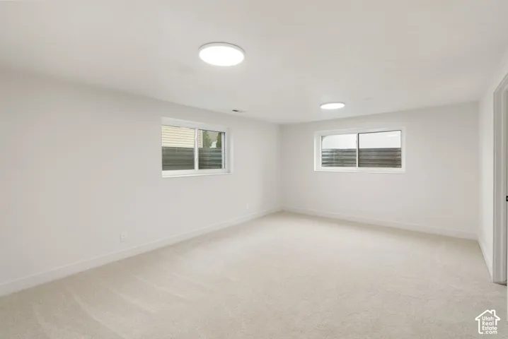 Neutral carpeting and light-toned walls