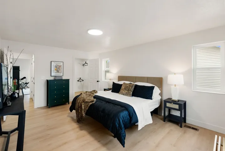 Light wood-finish flooring with white walls