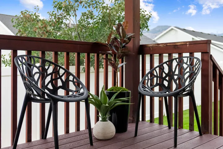 Outdoor deck with wood-finish flooring and railing
