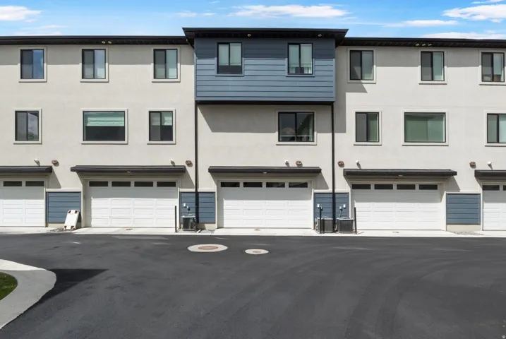 Contemporary multi-story exterior with stucco and horizontal siding accents