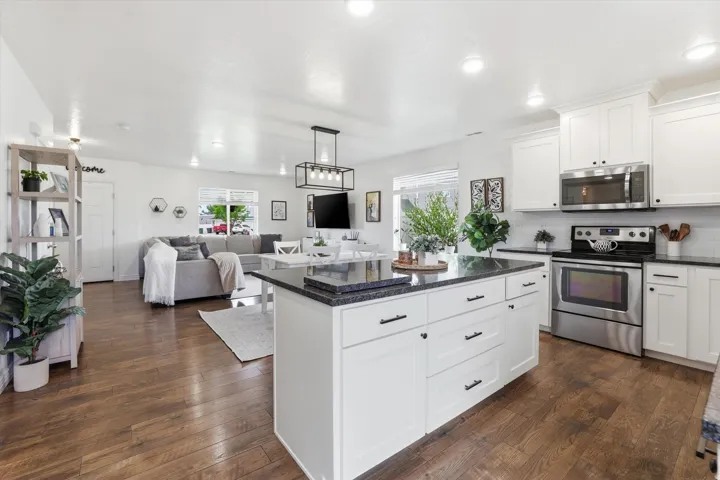 Open-concept layout with wood-finish flooring