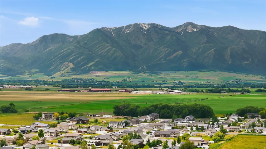 Expansive mountain range backdrop with distant snow-capped peaks