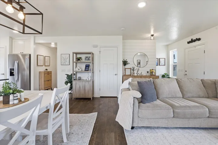 Open-concept living space with dark wood-finish flooring