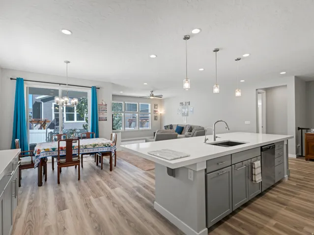Open concept living area with wood-finish flooring