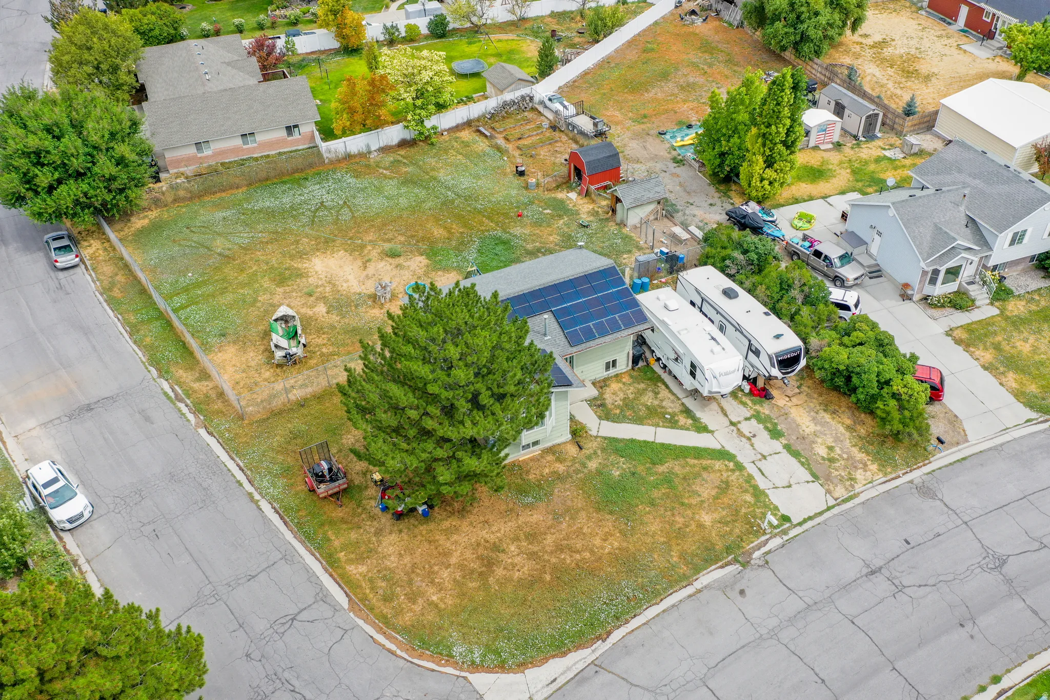 Single-family residence with solar panels and a concrete driveway