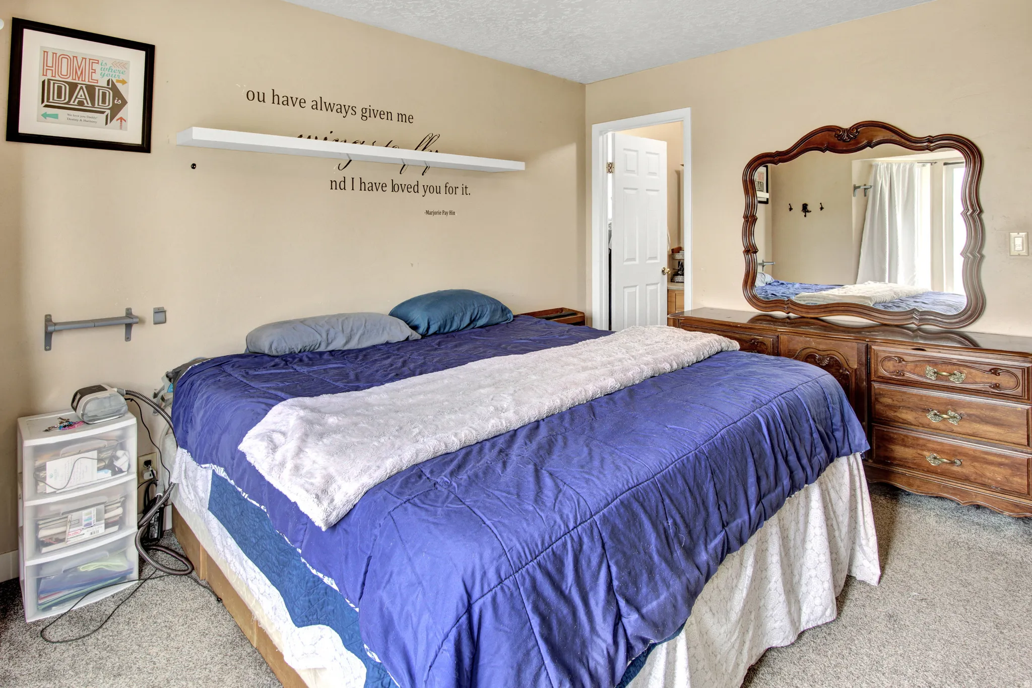 Wall-to-wall carpeting and neutral wall paint