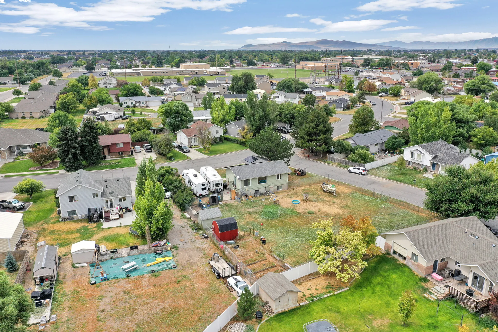 Residential neighborhood with mature trees and paved streets