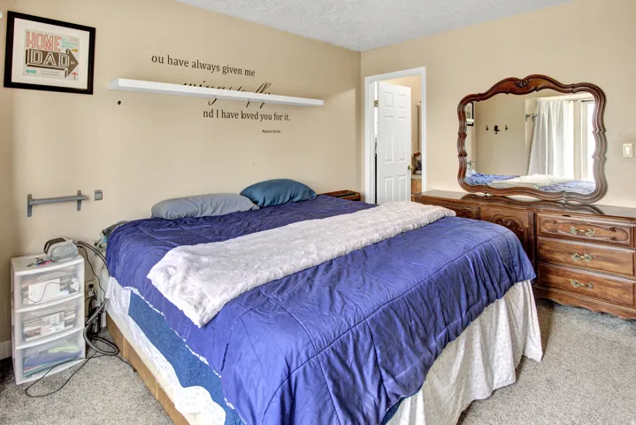 Wall-to-wall carpeting and neutral wall paint