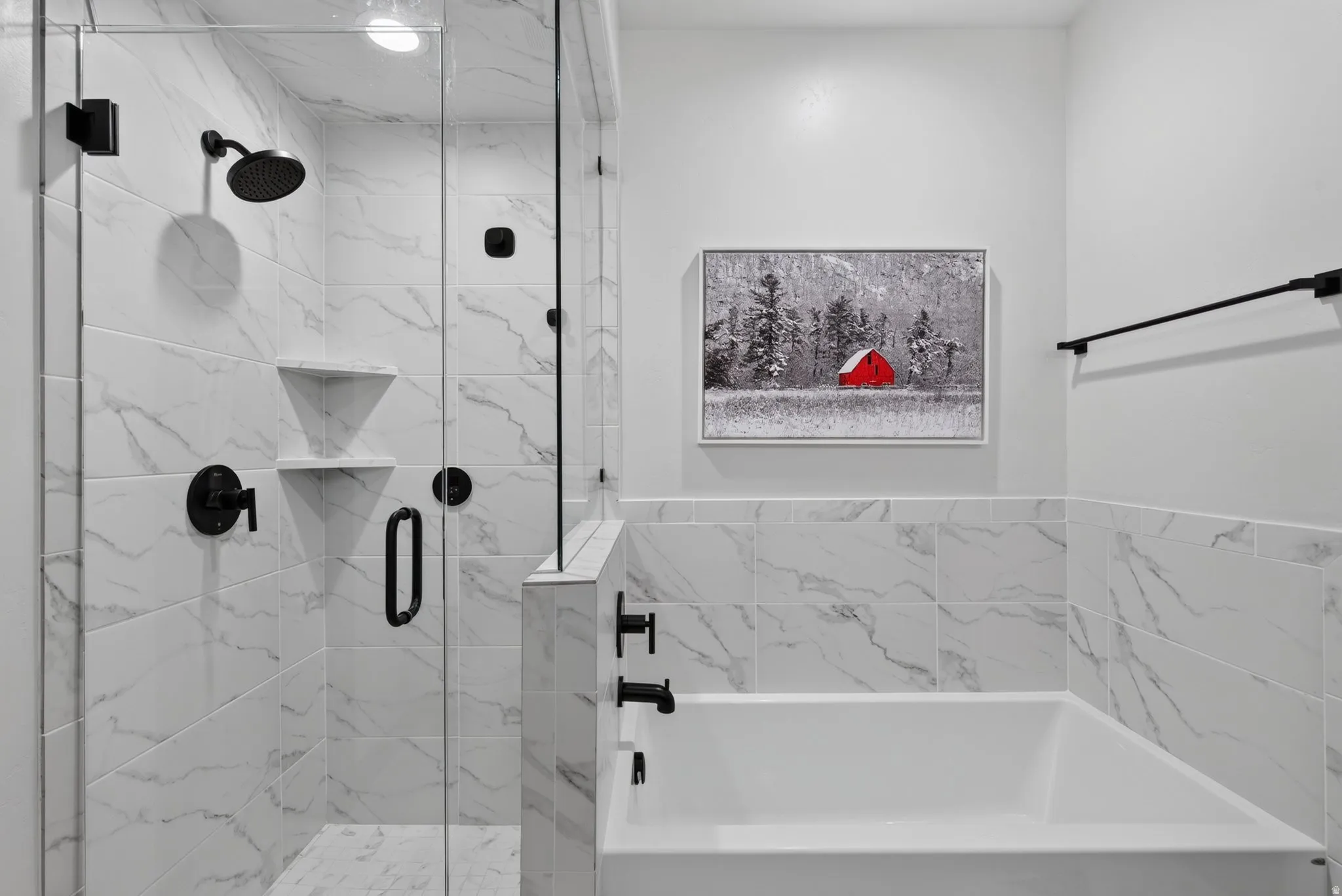 Glass-enclosed shower with matte black fixtures, integrated shelving, and white marble-look tile