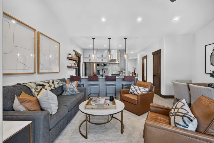 Integrated living space featuring wood-finish flooring and recessed lighting