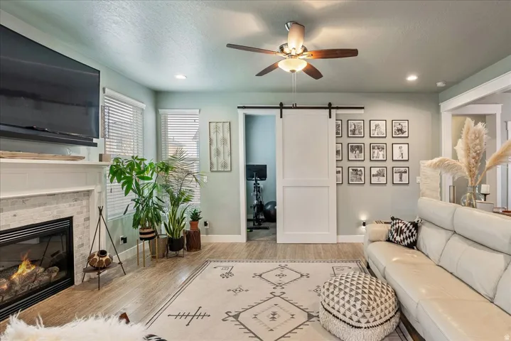 Fireplace with light-colored tile surround and white mantel