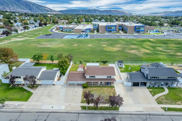Expansive green space and mountain backdrop