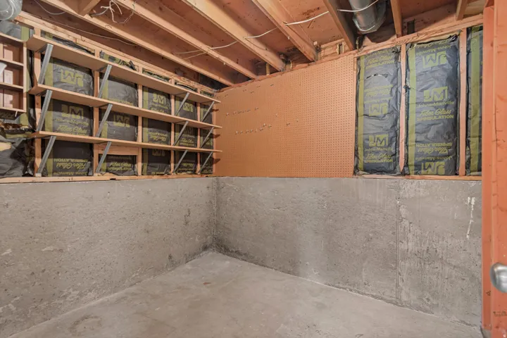 Concrete flooring and walls with exposed ceiling joists