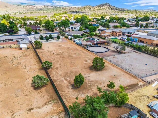 Expansive land parcel featuring natural terrain and established perimeter fencing