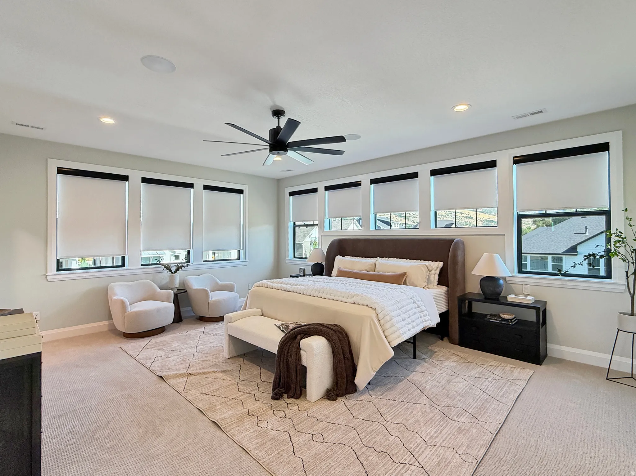 Recessed lighting, ceiling fan, and carpeted flooring