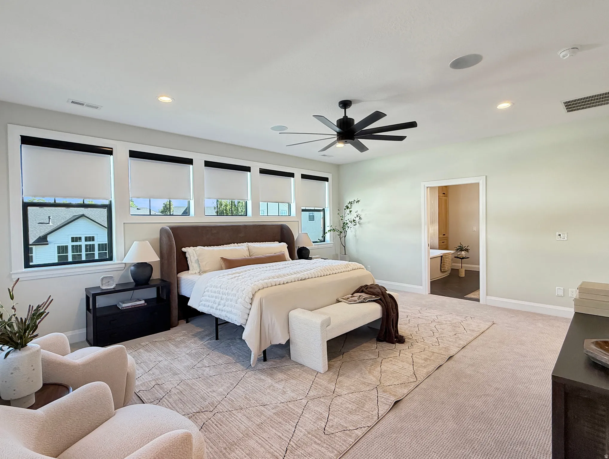 Recessed lighting, ceiling fan, and carpeted flooring