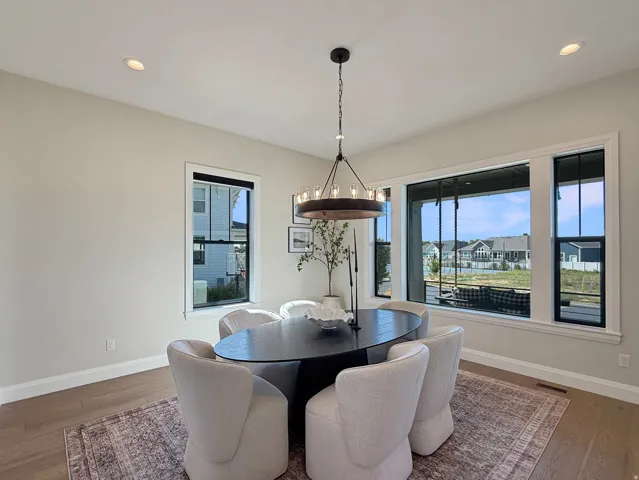 Recessed ceiling lighting complements a contemporary chandelier
