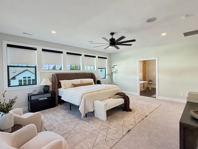 Recessed lighting, ceiling fan, and carpeted flooring