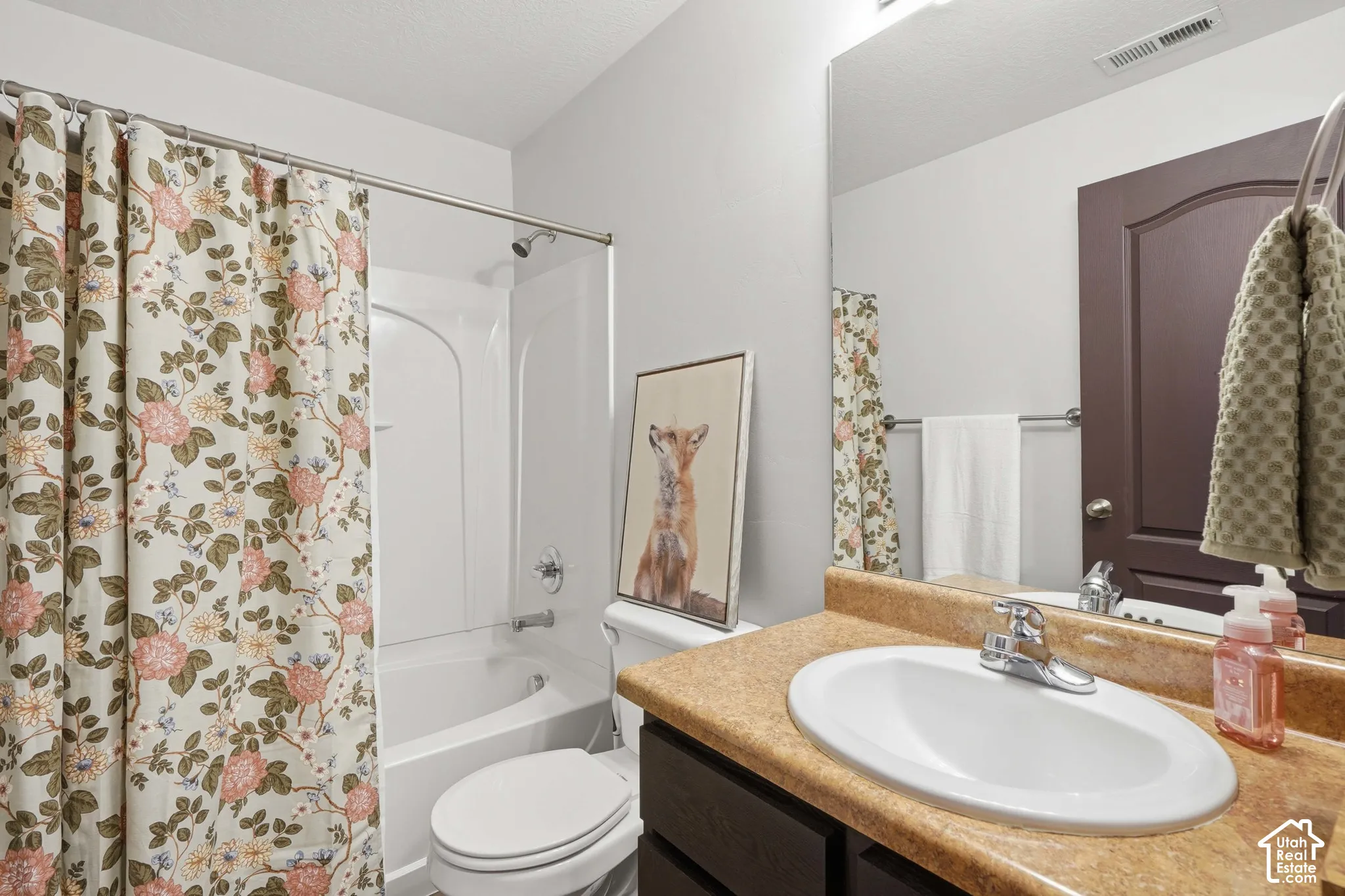 White tub and shower combination with a single-handle faucet