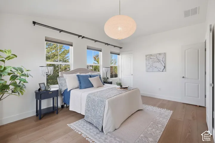 White walls with wood-finish flooring