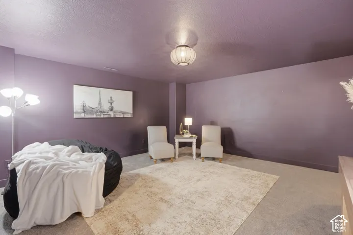 Carpeted flooring, recessed lighting, and a drum-style ceiling light fixture