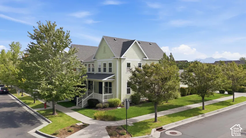 Charming Colonial-style residence showcasing a distinctive peaked roofline and gabled architecture