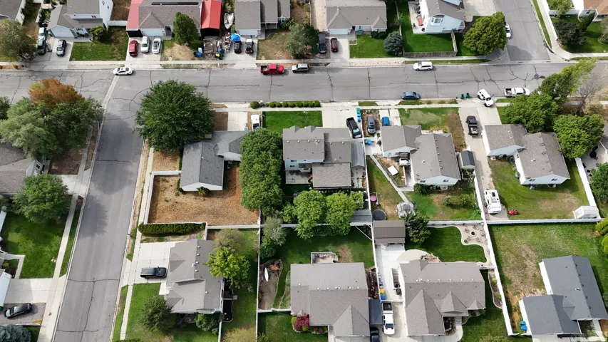 Aerial perspective showcasing residential properties with established landscaping and paved streets