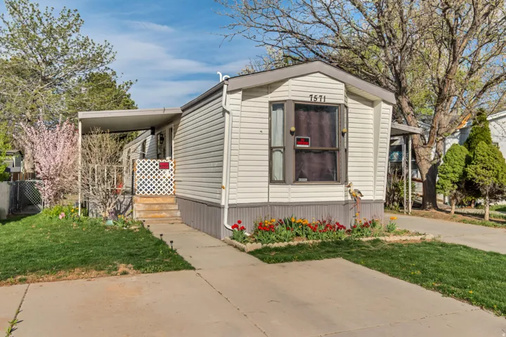 White horizontal siding exterior with a grey trim