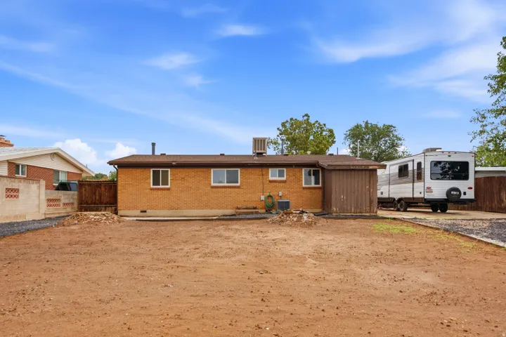 Brick residence with expansive grounds featuring newly seeded backyard, and RV parking